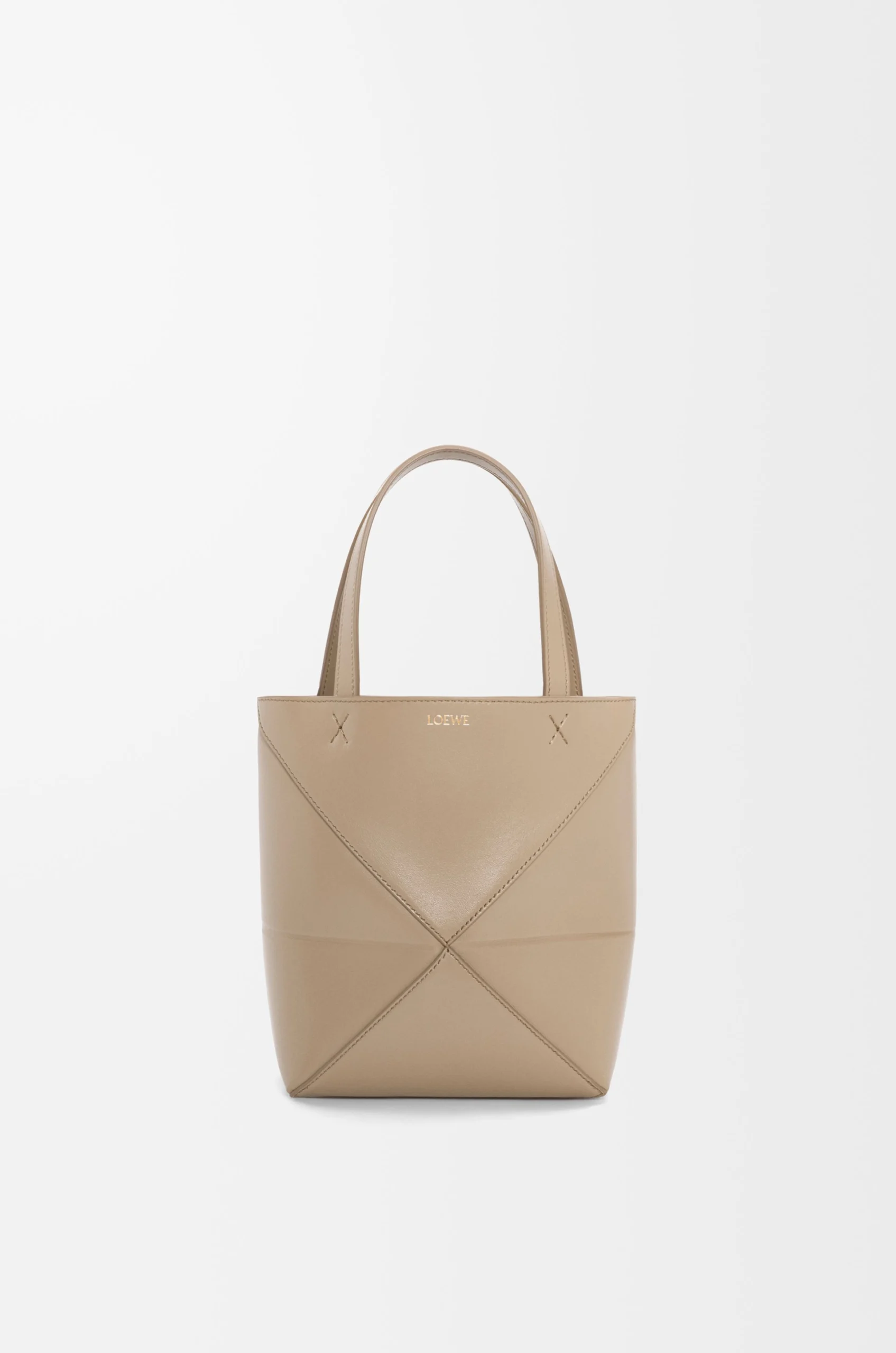 aed2ec354fa58f0637ce2abb416bd5dd-scaled-1.webp Mini Puzzle Fold tote in shiny calfskin - Image 1