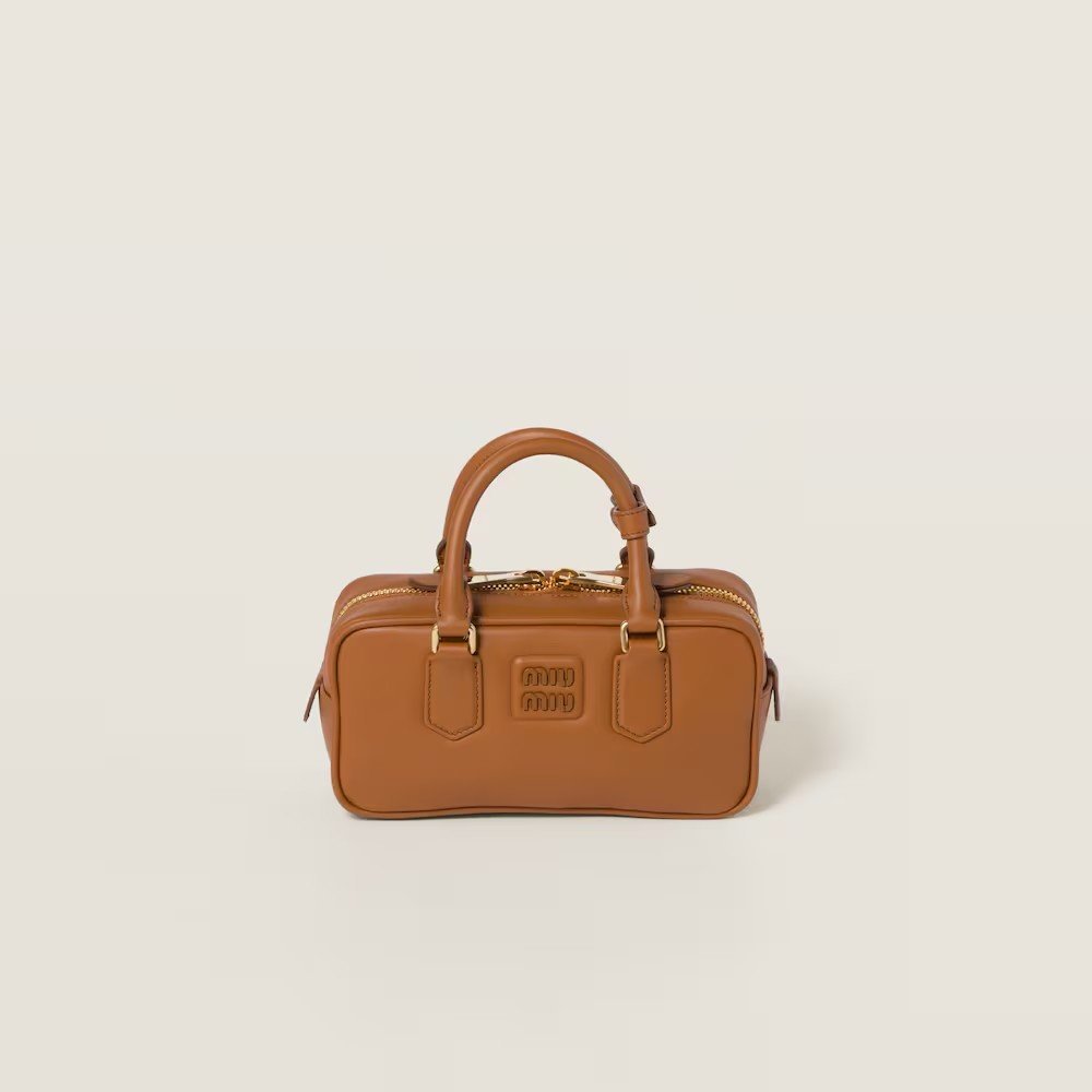 f21b2e8efccb79f8c456919020fa7492.jpg Arcadie Leather Small Handbag Cognac color - Image 1